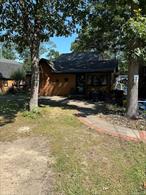 Home needs Work, This home features large living room, dinning room, Den w/ woodburning stove , laundry room, eat in kitchen, over size2 car garage with large loft, 2 attics, large yard, feced backyard with 4 sheds, whole house generator