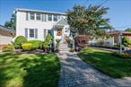 Welcome to this beautifully maintained Colonial-style home that truly has it all! Nestled in the heart of sought-after Bethpage, this spacious 4-bedroom, 3-bathroom gem offers incredible curb appeal and a warm, inviting atmosphere from the moment you arrive. Step inside to an open floor plan, featuring a bright and airy kitchen with vaulted ceilings, a huge center island, and abundant natural light. The kitchen flows seamlessly into a cozy den with fireplace, accented by skylights and stunning cedar wood vaulted ceilings that add warmth and character. Throughout the home, youâ€™ll find hardwood and laminate flooring, custom woodwork, and thoughtful finishes that blend timeless style with modern comfort. The primary suite is a peaceful retreat with an en suite bath featuring a jacuzzi tub. Flexible living space and plenty of storage. Step outside and enjoy your own oasis, a custom Trex deck with built-in seating and planters, overlooking a maintenance-free turf lawn â€“ year-round enjoyment and effortless outdoor living. Updates in last 6 years: windows and patio slider door, roof, driveway with beautiful stonework. Truly a must-see!