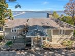 RIVER MEETS SKY - Perched above the horizon with a penthouse feeling in the sky, this rare 3787 SF open floor plan residence on 1.6 acres offers endless panoramic views of the Hudson River, Mario Cuomo Bridge and Piermont Pier - visible from every room. Drive through your gated entry, park in the two garage and step inside without a single stair to the main living space (with main floor primary bedroom) and be instantly captivated by the sweeping vistas that stretch for miles. Where the Hollywood Hills of the Hudson River meet the Mulholland Drive of Rockland County, 29 Tweed Boulevard sits among the area&rsquo;s most coveted residences. This property represents a rare opportunity to reimagine your dream home on one of the most prestigious streets in the region. This four bedroom, three and a half bath residence features three stately stone fireplaces that bring warmth and character, while a newly updated kitchen provides modern comfort. The rest of the home is a stunning blank canvas, awaiting a visionary&rsquo;s touch. Located just 30 minutes north of Manhattan - with easy access to Westchester and the Metro-North line - and only minutes from the riverfront villages of Nyack, celebrated for its artistic energy and vibrant cafe culture and Piermont, a postcard-perfect waterfront gem, 29 Tweed Boulevard offers a once-in-a-lifetime chance to live above it all... Where every sunrise feels like art and every evening ends in a golden river glow. Based on current list price this property is over assessed by 33.5% and is a candidate for tax grievance.