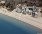 Step On To The Sand From Your Deck! Scenic, Very Protected Cove With Warm & Calm Waters. Tucked away at the end of a peaceful cul-de-sac in coveted South Jamesport, this classic beach home sits on a rare double lot with 70 feet of sandy bay frontage and breathtaking panoramic views of Great Peconic Bay. Part of a charming colony of homes, this property offers exceptional privacy and endless possibilities. Home features 3 bedrooms, 2 full bath, walls of glass, and detached garage. New Central air, ample storage, raised A-Frame. A once-in-a-lifetime opportunity to own prime bayfront property in one of the North Forkâ€™s most sought-after locations. Exterior security cameras. Professional Photos to come.