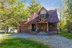 CUSTOM LAKEFRONT RETREAT â€“ Welcome to this spectacular, sun-filled 4-bedroom, 3-bath custom Colonial set on 1.5 acres of park-like property with Congers Lake as your backyard, located in the award-winning Clarkstown School District. This beautiful home features soaring ceilings with exposed beams, hardwood floors throughout, a spacious living room with a striking stone fireplace, and French doors that open to a extra large patioâ€”perfect for outdoor enjoyment and entertaining. The updated kitchen offers granite countertops and stainless steel appliances, flowing seamlessly into a banquet-sized formal dining room, with a full bath completing the main level. Upstairs, you&rsquo;ll find a generous primary suite with an ensuite bath, along with three additional spacious bedrooms and another updated full bath. A charming front porch with a custom front door, a sprawling backyard patio with serene lake views, an attached 2-car garage, and a prime location near parks, shopping, and major commuting routes to NYC, NJ, and Westchester complete this rare and exceptional lakefront gem.