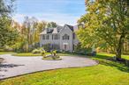 Stunning Georgian Colonial on Nearly 3 Acres â€“ A Perfect Blend of Elegance, Comfort, and Privacy!!!Welcome to this breathtaking 4-bedroom, 3-bath Georgian-style Colonial, gracefully set on nearly 3 acres of lush, park-like grounds. This exceptional home offers the perfect balance of timeless sophistication and modern comfortâ€”ideal for both everyday living and unforgettable entertaining.From the moment you enter, youâ€™re welcomed by soaring cathedral ceilings in the foyer and family room, creating a grand yet inviting ambiance. The open-concept layout seamlessly connects the living, dining, and kitchen areas, making it easy to host gatherings or enjoy quiet moments with loved ones.The formal dining room is perfect for holiday celebrations, while the cozy living room and den offer peaceful retreats for reading, relaxing, or game nights. At the heart of the home is a sunlit, spacious kitchen designed to inspireâ€”featuring abundant counter space, a large pantry, and a layout thatâ€™s as functional as it is beautiful.The family room, with its dramatic ceilings and charming wood stove, is a warm and welcoming space where memories are madeâ€”whether you&rsquo;re curling up by the fire on a chilly evening or entertaining guests year-round.Upstairs, the luxurious primary suite is your private sanctuary, complete with a full bath, sitting room, and three walk-in closets. Three additional generously sized bedrooms and gleaming hardwood floors throughout provide comfort and flexibility for family and guests alike.The walkout basement opens to a serene backyard oasisâ€”perfect for summer BBQs, family gatherings, or simply enjoying the peace and beauty of nature. Whether you&rsquo;re entertaining a crowd or savoring a quiet morning coffee, this home offers the best of both worlds.With a dedicated home office for remote work and a versatile den for play or relaxation, thereâ€™s space for every lifestyle need.This is more than just a houseâ€”itâ€™s a place to call home, where every detail has been thoughtfully designed for comfort, connection, and joy.Come experience the warmth, privacy, and elegance of this extraordinary property. Your dream home awaits!