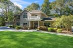 Welcome! This 5 bedroom 4.5 bath beautifully crafted Colonial is tucked away on a peaceful 1.09 acre setting in one of Syossetâ€™s most sought after neighborhoods. This home blends warmth, comfort, and quality craftsmanship throughout nearly 3, 800 square feet of living space. The layout is designed for everyday living and effortless entertaining. The living room boasts a tray ceiling, antique knotty pine floor that adds to the character and charm, as well as French doors which open to the bluestone rear deck, inviting natural light and easy indoor-outdoor flow.The heart of the home is the spacious kitchen showcasing dovetailed custom cabinetry, a large center island, professional high end appliances, and thoughtful design that makes cooking and gathering a pleasure. The oversized den with wood burning fireplace and custom built bookshelves offers a cozy retreat, while the formal dining area accommodates large gatherings with ease. There is also a 1st floor bedroom and1 full bath and a powder room on the main floor.Upstairs the primary en-suite is complete with a Juliet balcony overlooking the tranquil backyard. 3 large additional bedrooms and a convenient laundry room complete the second floor. Outside mature trees, lush lawn and a quiet yard create a sense of privacy and calm. Enjoy evenings on the deck or unwind in the hot tub.16 Pine offers a perfect blend of warmth, quality, and tranquility- a place where every detail has been considered!