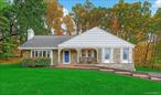 Nestled at the end of a peaceful cul-de-sac, this completely restored Baker-built Cape is a rare gem that blends timeless character with modern luxury. From the moment you step inside, you&rsquo;re greeted by glistening hardwood floors and classic six-panel doors, all framed by original dental crown molding that whispers of the home&rsquo;s rich heritage. The heart of the homeâ€”the kitchenâ€”is a chefâ€™s dream, outfitted with rich cherry cabinetry, gleaming granite countertops, a travertine backsplash, and top-tier stainless-steel appliances that make entertaining effortless.The bathrooms are equally impressive, featuring granite surfaces, porcelain tile, and high-end fixtures. Frameless shower doors add a sleek, spa-like feel. Every detail has been thoughtfully upgradedâ€”even the electrical service has been enhanced to 220 volts, ensuring both comfort and convenience.But the improvements donâ€™t stop there. The sunroom has been transformed into a year-round retreat, with new windows, doors, flooring, and its own heatingâ€”perfect for morning coffee or cozy winter reading. Downstairs, the finished basement offers flexible space for a media room, gym, or playroom, while the finished attic is ideal for a home office, guest suite, or creative studio. Recessed lighting brightens every room, and even the closets have been thoughtfully illuminated for added functionality. Newly installed 6-inch gutters help protect the home, while a natural gas boiler and water tankâ€”both installed in 2017â€”ensure reliable comfort through every season.With a five-minute commute to the Taconic State Parkway, this home offers the perfect blend of tranquility and accessibility.Itâ€™s not just a houseâ€”itâ€™s a must-see sanctuary waiting to welcome you home.