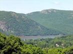 Spectacular Hudson river views, beautiful grounds, in-ground pool and total privacy. 24 x 16 Living room w. fieldstone frplc, redwood paneling and 20 ft. of glass opening to covered porch. Family rm. w. wood burning stove which opens onto deck. FDR, Den or 1st flr. BR. w. bath. 4 BR&rsquo;s, 3 Bths. A Unique country retreat or full time private residence on 12 acres. Additional Information: ParkingFeatures:2 Car Detached,