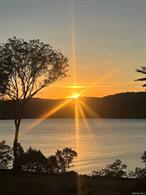Spectacular 10+ acres of breathtaking Hudson River views and frontage with more than 500 feet of direct riverfront and panoramic sunset views. This exceptional building lot features a beautiful stone wall along the historic Wheeler Hill Road, mature trees for privacy, and beautifully landscaped grounds. Enjoy the short 2 minuter drive to the Metro-North train station for an easy commute to NYC. The property is surrounded by the best of the Hudson Valley â€” local farm stands and farmers markets, Obercreek Farm & Brewery, apple orchards, and outstanding restaurants. Beaconâ€™s vibrant Main Street is just 10 minutes away. Ideally located just 90 minutes from New York City with convenient access to Metro-North, I-84, and I-87.Existing improvements include a 2, 200 square foot home built in 1951 and a detached garage. Driveway is in, power to the existing home and garage, municipal water connection, and other infrastructure already in place. Bring your plans, architect, builder, and vision â€” opportunities like this are exceedingly rare.