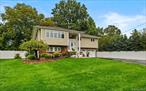 Welcome to 3 Farmstead Road Located in the Award-Winning, Blue-Ribbon School District of Commack! This Renovated 4-Bedroom, 2.5 Bath Hi-Ranch Offers Exceptional Curb Appeal, and All the Modern Amenities. Step Inside to an Open Floorplan with a Large Living Room, and Formal Dining Room. The Primary Bedroom Has a Private Ensuite Full Bathroom. 1st Floor Oversized Bedroom, and Large Den Which Leads directly out to the Backyard. Hardwood Floors, Central Air Conditioning, Rear Paver Patio, 2nd Floor Deck, Oversized Driveway, 2-Car Garage, Professionally Landscaped, and So Much More!!