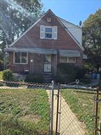 Welcome to 13404 Farmers Blvd. 2 Family Home... 1 bedroom, 1 bathroom, living room and kitchen on 2nd floor. 2-bedroom, 1 bathroom, living room and eat in kitchen on the 1st floor. NEEDS TLC. INVESTORS DELIGHT.
