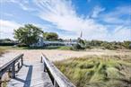 Perched on the edge of Tiana Bay, this year-round co-op offers an effortless blend of comfort and coastal living. Set on five beautifully landscaped acres just moments from downtown Hampton Bays, itâ€™s a place where every day feels like a getaway.The second-story residence enjoys sweeping water views and natural light throughout, with skylights, high ceilings, and an open-concept living and dining area that connects seamlessly to a private balcony overlooking the bay. The updated kitchen, cozy fireplace, and airy one-bedroom layout create a warm and inviting retreat designed for easy living.Life at Hampton Arms is defined by its exceptional amenities â€” from a heated bayfront pool, tennis and pickleball courts, and a clubhouse with game room, wet bar, and fitness area, to a waterfront fire pit, grilling stations, dock access, and boat storage. With beaches, waterfront dining, and local conveniences nearby, thereâ€™s little reason to go anywhere else.An idyllic place to hang your hat whether for a weekend escape or a full-time stay; this is Hamptons living made easy.