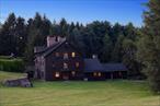 For the first time in history, Mill Farm â€” Spanning more than 2, 000 contiguous acres in Ancramdale, New York, â€” is being offered to the market. Almost all of the farm is surrounded by thousands of acres of adjacent protected conservation land, making it the only 2, 000-acre working farm in the region, ensuring a level of privacy and ecological integrity that cannot be duplicated. Steeped in history, The Mill House dates back to the Revolutionary War era and the Livingston family, and is the conversion of the famed Grist Mill â€œDefiance, â€ a rare surviving landmark of early American industry that established the regionâ€™s first foundation of commerce. At its core is the Mill House, an approximately 5, 600-square-foot architectural treasure set directly on the Punch Brook Stream, where the water flows through the home itself to power its historic hydro turbine mill system. There is a waterfall set close to the Mill House that is an ever present living feature of the environs, as it is closely visible from nearly every room. Adjacent, the former Mill Keeperâ€™s House has been reimagined as a private movie theatre, blending centuries-old character with modern indulgence. Crest Lane, an approximately 3, 500-square-foot masterpiece, stands as a second architectural jewel, featuring a windowed living room with sweeping views across the valley. Beyond these primary residences, the property includes 8 single-family homes, including four newly renovated cottages, each on its own deeded parcel, offering unmatched flexibility for family, guests, or future investment. The two main residences, the Mill House and Crest Lane, are connected by a three-mile internal gravel road system. The land itself is a defining asset. This is arguably the largest working farm within two hours of New York City, with organic-certified hay production, fertile valley floors, and rising elevations to both the east and west that frame extraordinary views. Rare 18th-century barns, including a remarkable Dutch Barn, stand as enduring testaments to Americaâ€™s agrarian history. An active windmill system still feeds water to various points across the farm, while aquifers and tributaries ensure abundant water availability. Recreational and ecological value are equally profound. The farm contains more than 18 miles of perfected, drivable trails that interconnect every corner of the property, creating a network for horse riding, exploration, and access to resources. Three miles of the untouched Punch Brook, a designated New York State trout stream, run through the propertyâ€”a pristine waterway under private stewardship. The farm is also home to documented bobcat habitats and study areas in partnership with Panthera.org. Its eastern boundary adjoins a vast conservation bird sanctuary, ensuring uninterrupted natural surroundings and extending the feeling of total seclusion for thousands of acres in every direction. Mill Farm uniquely combines agricultural productivity, historical resonance, and ecological significance. With its unmatched scale, legacy, and proximity to New York City, it represents an opportunity that exists nowhere else in the Northeast â€” a living landmark, never before available on the open market.