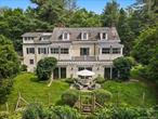 Set back from the road in one of Bedfordâ€™s loveliest estate areas, down a tree-lined drive, sits 328 McLain Street. Designed and built in 1906 by the distinguished firm of Delano & Aldrich as the country retreat of Judge Learned Hand, this gracious Colonial residence is nestled on 5.5 acres, with specimen trees, sweeping lawns, and perennial gardens that create a setting of rare serenity. The unmatched privacy and acreage within minutes of trains/schools/shops all just an hour from the city are perfect as a full-time or country house. Its timeless style makes it as appealing now as when it was first built.The house offers all the hallmarks of Bedford country living: swimming pool and chic cabana, charming guest cottage (think Brooklyn meets Paris), greenhouse, caretakerâ€™s cottage, detached garage, and a maintenance barn.Inside, the airy sunlit living room and the ample dining room, both with fireplaces, have French doors that open to an open plan sun-filled solarium, creating an easy flow. Outside the sunroom, a bluestone terrace overlooks an English garden that frames the additional acreage beyond. The chefâ€™s kitchen and adjoining sitting room provide a warm, informal gathering space.Upstairs, the primary suite offers a spacious, tranquil retreat, complete with a fireplace and an ensuite bath. Former sleeping porches have been reimagined as a playroom and guest quarters, while additional bedrooms, each with their own distinctive fireplace, enjoy garden views through large casement windows. The third floor adds further versatility with two generous bedrooms, a classic bath, and a sun-filled skylit artistâ€™s studio with adjoining atelier.This rare gem truly combines architectural pedigree, gracious proportions, and enduring charm.More land available