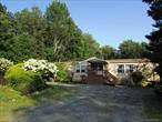 Looking to get a bit off the grid in a country setting? Then you need to check this one out....6+ Private Acres with a level wide open very private back yard perfect for gardening & games. But, best of all, a move-in ready recently updated country comfortable home. The updated kitchen is a joy with newer appliances, plenty of counter space & cabinetry along with a breakfast bar. Add the more formal dining area,  all open to the Living Room enhanced by the stone fireplace & oversized windows. OR Escape to the huge screened in deck & private back yard for summer to fall OR to the spacious Family Room with a Bixby Pellet/Corn Stove from Norway for those chilly nights. Add the convenience of a 24 x41 Foot insulated garage, Shed & Generator, all Ready & Waiting for you to make this one yours.