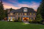 Privately gated and masterfully crafted, this exceptional custom brick estate is a showcase of timeless elegance and grand-scale living, nestled on over two acres in the heart of Chappaqua. Beyond the cobblestone apron and curbing, a sweeping driveway leads to a residence designed for both luxury and comfort, boasting soaring 10-foot ceilings, four stately fireplaces, exquisite architectural detail, and refined finishes throughout. Enter through a breathtaking grand foyer, where gleaming hardwood floors with intricate wood inlay medallion set the tone, and a dramatic three-story suspended spiral staircase anchors the home in architectural splendor. The main level is ideal for entertaining, offering a formal living room, formal dining room, an expansive family room with a custom bar, and seamless access to a private bluestone patio, perfect for indoor-outdoor gatherings. The chefâ€™s kitchen is a culinary masterpiece, featuring high-end appliances, breakfast area, butlerâ€™s pantry, and dual access points to the patio. A main-floor guest/au pair suite, private office or den, and powder room complete the level. Upstairs, the serene Master Suite is a retreat unto itself, complete with a sitting area, dual walk-in closets, and a spa-like marble bath with heated towel racks, dual vanities, clawfoot soaking tub, and an oversized glass shower. Three additional generously-sized bedrooms, one with an ensuite, and a full hall bath, along with a dedicated laundry room, offer both comfort and convenience. The third floor adds a spacious game and media room, while the walk-out lower level features a gym, mudroom, recreation space, sitting area, and access to the beautifully landscaped backyard. Outside, enjoy artisan stonework, multiple patios, a gazebo, hot tub, built-in BBQ station, and lush, level grounds ideal for entertaining and play. Three heated garages, including an electric vehicle charging station, complete this extraordinary masterpiece with modern convenience and sophistication. Located just minutes from Chappaquaâ€™s charming village center, award-winning schools, fine dining, shopping, Mt. Kisco Country Club, Metro North, and major highways. This is a a rare opportunity to own one of Chappaquaâ€™s most distinguished estates, an architectural triumph of timeless sophistication and commanding presence, set within one of Westchesterâ€™s most coveted communities.