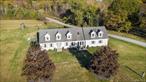Welcome to this beautifully updated Cape Cod-style home nestled on 1.26 acres in the scenic town of Hoosick Falls. With 4 generously sized bedrooms and 3 full baths, this 2, 918 sq ft home offers comfort, space, and versatility across two levels. The first floor features a bright and open living room, formal dining area, and a well-appointed kitchen, along with two bedrooms and a lovely 4-seasons mudd room â€” perfect for relaxing or entertaining. Upstairs, you&rsquo;ll find three additional bedrooms including a spacious primary suite with a walk-in closet and a cozy gas fireplace. Additional highlights include a heated 2-car attached garage, paved driveway with ample parking, central security system, and ductless A/C for year-round comfort. The cleared and landscaped lot offers a peaceful, level yard with room to roam. Enjoy privacy and tranquility with modern amenities just minutes from Bennington, VT and local conveniences. Don&rsquo;t miss this opportunity.