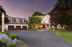 Follow the long meandering driveway to the place you&rsquo;ll call HOME, 55 Townsend Farm. An amazing get-a-way situated on almost 10 acres of privacy in the heart of the Hudson Valley. This stunning Farmhouse Colonial has it all. The main house features almost 7000 finished SQ FT, 4/5 bedrooms, 5.5 baths and full rocking chair front porch. Step into the grand 2-story foyer where you are welcomed into the open first floor plan that features 9&rsquo; ceilings throughout, custom yellow pine wide plank floors, formal living and dining rooms, office, first floor bedroom with en suite full bath and powder room and laundry/mud room with floor to ceiling custom lockers. The updated chefs kitchen with a light filled breakfast nook, with Viking range, 42 white shaker cabinets, Quartz countertops and stainless steel appliances opens to the 2-story great room centered around the stone floor-to-ceiling gas fireplace that leads into the cedar lined sun room with oversized windows and double French doors allowing ample natural light and egress to the outdoor oasis and blue stone patio. Upstairs you will find the primary suite with tray ceilings, oversized walk-in closet and en suite bathroom with soaker tub, double vanity and custom tile shower with glass surround. Two well sized bedrooms share a Jack & Jill full bath with a fourth princess suite. Full finished lower level has just over 2000 SQFT featuring a gym, movie room, full bath and rec/billiards room and walk-out, perfect for entertaining! Welcome to your outdoor oasis, a true Shangri-La with gunite in-ground pool with all new systems, full outdoor kitchen and bar, pool house with full bath and kitchen and full sized basketball court. Mature landscaping and gardens that have taken years to create, RAB landscape lighting and SONOS controlled audio with multiple zones throughout the entire home and pool area. Oversized 3-car garage with unfinished walk-up attic for additional storage or future bonus room and detached oversized 2-car garage at the back of the property making a total of 5 garage bays. Additional features are new roofs with warranties, full house Ubiquiti Wi-Fi with multiple access points, freshly painted throughout, in-ground irrigation, and newly sealed driveway. Excellent location, right off the Taconic PKWY, private yet relative, close to culinary grade restaurants, schools, shopping and more! Just over 70 miles to NYC, this makes the perfect weekend get-a-way or full time residence. Come see all that the Hudson Valley has to offer!