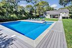 Resort-style living in the very heart of vibrant and desirable Hampton Bays! This completely turn-key and updated Residence is a true gem in every sense of the word, and is suitable for just about everyone&rsquo;s needs and desires! The backyard oasis features a custom-built, heated, saline swimming pool with an adjoining hot-tub, surrounded by generous trex decking, wonderful for entertaining and/or simple relaxation. There is also a covered stone patio overlooking the pool area, which is perfect for your outdoor barbecuing and enjoying your summertime refreshments! Indoors, you will find the Primary Bedroom and a Guest Bedroom conveniently located on the First Floor, as well as two other Guest Bedrooms and a Bonus Room located on the Lower Level. The entire home is light and bright, with hardwood floors, abundant recessed lighting, beautiful Kitchen cabinetry and lovely finishes throughout. There is an outside entrance from the Dining area leading to a private deck with stairs and a walkway to the pool. The Lower Level also features a separate walk-out to the rear yard. The location is fantastic as well, within close proximity to the School, the Train Station, the World-Class and Highly-Rated Ocean and Bay Beaches, Waterfront Restaurants, Entertainment Venues and Shops. It is also centrally located to all of the villages of the Hamptons, from Westhampton Beach, east to Montauk. For a slightly different vibe, the famed North Fork is also a short distance away, where you may visit and enjoy the numerous Vineyards, Farmstands, Restaurants, Golf Courses and Sound and Bay Beaches, for which it is renowned. This home is a true Must-See and makes for an ideal seasonal or year-round Residence.