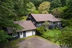 Welcome to 91 Old Queens Highway, a beautifully updated and fully furnished, 3-bedroom, 1.5-bath cabin set on 21 acres of quiet, wooded privacy in the heart of Kerhonkson. This spacious home blends Scandinavian design with rustic warmth, featuring light pine wide-plank floors, exposed beams, concrete countertops and built-in shelving throughout. Cozy up by the wood-burning stove or enjoy year-round comfort with efficient mini-splits for both heating and cooling.The main living space opens onto a charming three-season porch and deck, perfect for dining outdoors or taking in the peaceful surroundings. The main level has both of the homeâ€™s baths and two spacious bedrooms. Upstairs,  a serene loft offers an additional sleeping space and a lovely home office or studio. Outside, youâ€™ll find a cedar sauna, a fire pit and acres of beautiful woods to roam and explore. There is an expansive lawn and a small garden ready for your vision. The property also includes a one-car garage and ample storage.Ideally located just over 100 miles from NYC, this stylish retreat has easy access to some of the Hudson Valleyâ€™s best attractions including Mohonk Preserve, Minnewaska State Park, Inness, Arrowood and Westwind Orchard. Kerhonkson is located 25-35 minutes from Kingston and New Paltz, and is a great jumping off point to explore the region! Coming fully funished, and available for a seasonal or long-term lease, 91 Old Queens Highway is the perfect upstate getaway for those seeking privacy, design, and connection to nature.