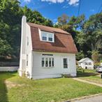Completely remodeled 3 BR, 2 BA Dutch Colonial in beautiful Tuxedo, NY. Gleaming hardwood floors and neutral color palette extend throughout the 1st and 2nd levels. Formal living room showcases woodburning fireplace with brick surround a timeless wood mantle. The dining area enjoys custom built-ins and is located just off of the updated kitchen where you&rsquo;ll enjoy white cabinetry, tiled backsplash, granite counters and stainless steel appliances. Wide door and window trim are a few of the period details that blend the old with the new. Ground floor bedroom and full bath complete this level. Ascend the stairs and discover two additional bedrooms and a beautifully refinished full bath. The full basement is unfinished but is home to the washer and dryer and provides additional storage options. The backyard climbs up a small hill, but a new stone retaining wall has been carved out to define a large, raised patio. In close proximity to Tuxedo School, this home has the benefitted use of a wide open green space and adjacent playground. Tuxedo offers NYC transit options via bus or train and is in close proximity to state parks and a private golf course.