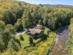 Rarely Offered Home on the BeaverkillSet beside the famed Beaverkill River in Lew Beach at the gateway to the Beaverkill Valley, this immaculate 4, 000+ square-foot custom ranch offers one of the most exceptional riverfront settings in the Catskills.Fully renovated and expanded in 2006, the home blends quality craftsmanship with an intimate connection to nature. Nearly every main roomâ€”including the living room, dining room, kitchen, breakfast room, and primary suiteâ€”overlooks the river, with broad windows framing the rushing water and surrounding forest.The entry opens to an expansive sitting area that includes a library with a two-sided fireplace and a living room seemingly perched above the river. A large covered porch provides a front-row seat to bald eagles, deer, and the sounds of the Beaverkillâ€”perfect for outdoor dining or quiet mornings.The first floor includes three bedrooms, an office, and three full baths. The ground-floor primary suite features a walk-in tiled shower and generous closet. The lower level adds two additional bedrooms, a full bath, a large recreation area, a paneled gathering room, and abundant storage, including a secure vault room and space for sporting equipment.Additional features include central air conditioning, hardwood floors, a generator, high-speed internet, and three garage bays accessed from a private courtyard off Beaverkill Valley Road.Half-acre riverfront. Two additional five-acre parcels available across the road for privacy and flexibility. Under two hours to NYC, minutes to Livingston Manor.