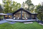 A Private Modern Retreat Where Every Detail is Perfectly Considered Set on 2.23 wooded acres of serene privacy, 83 Sages Loop is a newly reimagined residence where no detail has been overlooked. Completed between 2024 and 2025, this 3-bedroom, 2-full bath home blends crisp modern efficiency with warm, welcoming spaces-offering a perfectly turnkey lifestyle in an exceptional location just minutes from Minnewaska State Park, the Mohonk Preserve, and an easy two-hour drive to NYC. Inside, soaring cathedral ceilings and brand new efficient windows frame the surrounding forest, filling the interiors with natural light and ever-changing views. The heart of the home is a stunning chef&rsquo;s kitchen with all-new appliances, an induction range, a wet bar, and a dramatic 72&rsquo;&rsquo; awning window that opens to a breakfast bar-ideal for gatherings that flow seamlessly between indoors and out. Smart lighting and five-zone HVAC, all app-controlled, ensure comfort year-round. Tucked discreetly behind a wall of custom built-in bookcases lies a hidden door-an invitation to step into the home&rsquo;s most magical surprise: a secret bunk room. This enchanting hideaway is perfect for guests, children, or anyone who loves a touch of whimsy and privacy. Two dedicated media setups make movie nights and game days super cozy. The primary suite is a peaceful sanctuary with its own private patio, seating area, and an indulgent outdoor shower. Both bathrooms feature radiant heated floors, with the primary bath offering dual shower heads for a spa-like experience. Impressive Upgrades & Modern Comforts Nearly every surface and system is new, including: Roof, black gutters, and exterior paint (2025) Large Efficient windows (2025) R60 insulation on all surfaces (2024/2025) New mechanicals with 5-zone HVAC (2025) Smart lighting controls (2025) French drain system (2024) Radiant heat in baths and mudroom Extensive landscape design and installation (2025) The oversized 2 car garage offers flexible use as a studio or workshop, with parking for up to six cars on the newly expanded circular drive. The property is also pre-wired with Cat6e for security cameras and audio/video connections throughout. The Best of the Hudson Valley at Your Doorstep Enjoy the peace and quiet of a forested retreat while remaining close to beloved local destinations like Inness, Mill & Main, Arrowood Farm-Brewery, and Westwind Orchard. Whether entertaining, relaxing, or exploring the region&rsquo;s endless hiking trails, farm-to-table dining, and cultural offerings, 83 Sages Loop is a rare blend of modern convenience, natural beauty, and thoughtful design.