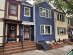 Discover this wonderful 2-Family home perfectly situated steps from Myrtle Avenue and the beauty of Forest Park. Ideal for an owner-occupant or investor, the property features a roomy 2-bedroom unit on the main floor and a generous 3-bedroom unit above. Practical amenities include a full, partially finished basement with a convenient laundry area.