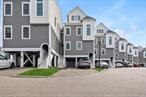 Spectacular Waterfront Townhouse with Scenic Views! Enjoy beautiful waterfront views and watch geese and ducks from your deck. The community features a picnic table area, dog run, and a walking trail. Conveniently located within walking distance to restaurants, coffee shops, the LIRR and shopping. Just a 5-minute walk to the park and a 5-minute drive to the beach. Inside, youâ€™ll find an eat-in chefâ€™s kitchen with under-counter lighting, a kitchen island, pantry, and quartz/quartzite counters. The open floor plan includes a formal dining room, high ceilings, recessed lighting, natural woodwork, and an open kitchen. The primary suite offers his-and-hers closets, a walk-in closet, and a luxurious bathroom with a soaking tub. Appliances include: Convection oven, cooktop, dishwasher, dryer, freezer, gas cooktop, gas oven, gas range, microwave, oven, range, refrigerator, washer, and stainless steel appliances. Additional Features: Elevator, Fire alarm and water sprinkler system directly linked to emergency response Two-way intercom at front entrance, Power outlets on decks and in the included shed No dog restrictions (well-mannered pets welcome) Annual exterior checks and cleaning by property management No flood insurance required (covered by property management) 160;Property tax abatement until 2029 Dock slip available