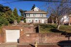 Welcome to 196-33 Foothill Avenue, Holliswood, Queens County! Holliswood is one of the countyâ€™s most coveted, prestigious and well known enclaves. This stately and grand detached classic Colonial is Located on an oversized 8271 sq ft lot with approx. 2576 square foot of living space. Built in 1933 this grand home on top of a hill offers so many possibilities with over 14 rooms, 8 bedrooms and 3 bathrooms. Set back from the street its stately grandeur, charm and character with its detached one car garage and brick walkways and patio harken back to the time of its classic architecture style when it was built as a mansion! The first floor consists of an entrance foyer, porch, renovated eat in kitchen with gas cooking and heating, formal dining room with a wood burning fireplace, 4 bedrooms and 2 full bathrooms. The second floor consists of three bedrooms including the primary with a wood burning fireplace and large closet or office and full bathroom. The Third floor has a large and wide walk up stairs to a finished attic with high ceilings and skylights. Neighborhood highlights include: Nearby Cunningham Park which offers tennis courts, trails and recreation. The community also offers playgrounds and local green spaces. School options including P.S. /I.S. 178 The Holliswood School, P.S. 35 Nathaniel Woodhull, I.S. 238 Susan B. Anthony. Transportation is convenient with the Hollis Long Island Rail Road station nearby, multiple bus routes, easy access to major roadways including Hillside Avenue, the Grand Central Parkway, and the Long Island Expressway.196-33 Foothill Avenue, Holliswood combines flexible living spaces, a sought-after location, and proximity to schools, transit, and recreation, this property presents the ideal balance of suburban comfort and New York City accessibility. The flexible layout offers so many possibilities.