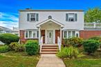 Welcome to 28 Elizabeth Avenue â€” a classic Colonial home designed for the way we live today, set gracefully on a corner lot in the heart of Hempstead.This 3-bedroom, 1.5-bath home offers more than 2, 600 square feet of thoughtful living space â€” from the warmth of its hardwood floors to the inviting kitchen with crisp white cabinetry and generous storage. Downstairs, a fully finished basement with an outside entrance provides flexibility â€” perfect for a media room, home office, or guest suite.Upstairs, two private balconies bring a breath of fresh air to your mornings and golden-hour evenings. Add in a 10, 000 sq ft corner lot, attached garage, and the rare comfort of being completely move-in ready, and you have a home that lives as effortlessly as it looks.Because at 28 Elizabeth Avenue, tradition and modern living come together with quiet confidence â€” the kind of home that feels both timeless and unmistakably yours.