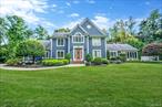 Welcome to 27 Tower Hill Road, Shoreham Villlage! A secluded and beautifully updated 3400+ sqft colonial home located in Shoreham-Wading River School District. Just steps from the beach, enjoy peaceful morning walks and your coffee by the shore, with deeded beach and boat ramp rights through Shoreham Shore Club. Inside, the home features a spacious layout with a large eat-in kitchen, flowing into bright and open living and dining spaces. The four oversized bedrooms offer generous closets, including a primary suite with its own full bath and additional storage via a hidden walk-up attic. A temperature-controlled wine cellar, updated hardwood floors, and a fully renovated basement with a state-of-the-art cinema room add style and comfort throughout. Enjoy peace of mind with newer systems including electric heat, backup oil boiler, 200-amp electric service, and a newly sealed foundation. Outside, relax in the beautifully landscaped yard with an inground salt water pool, outdoor sound system, new lighting, and no rear neighbors for total privacy. Conveniently located near all major public transportation, highways, shops, dining and so much more do not miss out on this amazing opportunity!