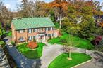 If you are looking for amazing, large, private, & flat property, look no further! This magnificent center hall Colonial is situated on stunning park-like grounds, refreshed to enhance its beautiful architectural features. The main floor is designed to meet today&rsquo;s coveted life style with a grand entry, formal living and dining rooms, family room, eat-in kitchen with exposed beams and high-end appliances, a sunroom with three exposures, and a bedroom with a full bath. This residence is perfect for indoor and outdoor entertainment with multiple french doors that lead to outdoor space boasting an impressively large terrace with a built-in barbecue. The formal living room features floor-to-ceiling windows, seamlessly bringing the outside indoors. The 2nd floor is equally impressive, with a primary suite featuring a balcony and luxurious bath, complemented by 4 additional bedrooms and three full baths. The lower level offers finished space ideal for recreation or home office. This expansive property provides ample room for a pool & tennis courts, guest home, or simply to enjoy as a private oasis.