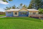 Starting out or scaling back? Enjoy easy, one-level living in this thoughtfully designed ranch set on a one-acre corner lot in the Pine Bush School District. Discover the perfect blend of contemporary style, comfortable floor plan and unique finishes that distinguish this special property. A welcoming front porch leads you inside to a bright, spacious interior where elegant pillars and arched doorways take center stage. The open layout is perfect for entertaining and the stunning kitchen is sure to impress with rich wood cabinetry, a center island, sleek tile backsplash, custom stone hood and stainless steel appliances - including a gas cooktop, double ovens and new dishwasher. Living room flows into the dining room and durable bamboo floors run throughout the entire home. The romantic primary suite is privately situated away from the other bedrooms and wood beams complement the space. A huge walk-in closet, dressing area and full bath with soaking tub, stall shower and dual sinks complete your peaceful retreat. Two additional bedrooms share the home&rsquo;s second full bath offering separate vanities for a bit more elbow room during the morning rush. Youâ€™ll love the mudroom with laundry, featuring a newer washer and dryer, conveniently tucked away from the kitchenâ€”no stairs to climb with heavy baskets! The full walk-up attic offers potential to finish or continue to use for storage. Take the fun outside to your stamped concrete patio and start planning the parties - thereâ€™s plenty of room for play, gardening or even a future pool in the large, level yard. Country road will take you home but don&rsquo;t be fooled as your home, sweet home sits under five miles from the heart of Pine Bush conveniences and just minutes to highway, train station, shopping, area attractions, restaurants, hospital and so much more!