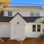 Welcome to 88 Cold Spring Rd, offering a fully renovated, move-in-ready Cape-style home with low property taxes! This property is loaded with quality details, such as recessed lighting with an optional amber halo effect to create a relaxing atmosphere, quartz countertops, matching stainless steel appliances, and soft-close cabinets. It also features a large kitchen island that flows into a formal dining area and living space, complete with a fireplace. Other great perks include the bedroom and full bath on the main level, as well as a fully converted garage space with exposed beams, vaulted ceilings, and sliding doors that step onto a deck (soon to be stained) overlooking the back yard. Moving upstairs are two bedrooms, each with exposed beams and plenty of closet space. The primary bedroom (upstairs) has its own full bath and walk-in closet, in addition to two other closet spaces. This property also has a full, unfinished basement, which steps out onto a newly stained deck. Located just near Highway 17, just outside the town of Liberty, all while only 2 hours north of NYC! Call to schedule a private showing today!