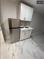 Second Floor Village STUDIO Apartment, Completely Refurbished, Ceramic Tile Floors Throughout, New Windows, New Bathroom. Bus Stop Across the Street, Walk into Town, 3 miles to Stony Brook, .5 Mile to Train - Open and Bright, Freshly Painted - Plenty of Natural Light comes Through- Close to LIRR, St. Charles, Northwell, Ferry - Live Theater Next door, Park, Basketball Court, Tennis and Pickle Ball within minutes.Tenant pays electric and heat. Owner Pays Water- One-year Lease Available with Option to Extend Must go through the Zillow Rental Application Credit, Income, and Payment Rental Verification ( Must provide proof of past rental history )