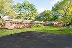 â€œHome in Hartsdaleâ€ Welcome to this beautifully maintained mid-century modern gem, offering privacy, space, and timeless design. Nestled on a quiet lane, this 4, 300-square-foot home features five spacious bedrooms, including two en-suites, and a total of four full bathrooms â€” perfect for comfortable living and effortless entertaining.Step through the stunning front door, a true showstopper, into a unique and elegant foyer that sets the tone for the rest of the home. The large eat-in kitchen overlooks a serene, expansive backyard complete with a breathtaking bluestone patio â€” ideal for relaxing or hosting guests.Two additional versatile rooms with backyard access offer endless possibilities: home office, playroom, gym, or guest suite â€” the choice is yours.Located just minutes from Ridge Road Park, a variety of shops, restaurants, and all major conveniences, this home offers the perfect blend of tranquility and accessibility. Commuters will appreciate the short drive to Metro-North and other public transportation options.If you&rsquo;re looking for a forever home that stands apart from the rest, look no further â€” 10 Barnaby Lane is ready to welcome you home.