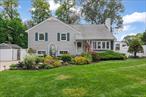 Welcome to 86 E 24th Street Huntington Station. This spacious 4 level Split level home features 4 bedrooms, 2 full baths and many updates. The home is set back from the street, on a 1/4 acre of manicured grounds. The inground saltwater pool has a new liner (3 years) new filter and variable speed pump and saltwater generator (2 years) and natural gas for the heater. Truly made for entertainment and enjoyment.The exterior features updated vinyl siding, windows and doors.There is a classic Formal living room featuring hardwood floors, a wood burning fireplace with a wall of built in cabinetry and shelving and large crown moldings on the ceiling. A formal dining area which can comfortably seat 10-12 guests and features a formal chandelier and recessed LED lightingA Beautiful spacious kitchen. Appliances include a GE double oven, ceramic electric cooktop with a Samsung microwave/ exhaust fan above the cooktop. A corner sink with garbage disposal, a dishwasher and LG stainless refrigerator with ice and water dispenser A handy center island with marble inlay and bar height stools for 4 are adjacent to the Andersen glass slider doors leading out to a Trex deck down to the yard.The true highlight of this home is the Huge Den/Family Room. Here you will find a lovely gas fireplace with stacked stone going from floor to ceiling, recessed led dimmable lighting and ample room for a large seating area great for entertaining. Off the Den/Family Room you exit thru a 9 foot glass slider with built in blinds to a true backyard paradise. A patio covered by an aluminum awning with a ceiling fan over stamped concrete, a perfect spot to enjoy your morning cup of coffee or a meal. A hard top gazebo covers an outdoor dining area suitable for a table for 10. Another adjacent seating area with cushions forms a comfortable spot to enjoy your outdoor propane gas firepit.Up the stairs from the entryway is another level where you will find 3 bedrooms including the large primary with a walk-in closet. The family bath features a vaulted ceiling with sky light , beautiful tile, an extra deep tub and a new vanity and sink. There is still another level where you will find the 4th bedroom with closet and numerous built in drawers.This home features beautiful hardwood floors throughout, and a Large unfinished Basement with extensive shelving and lots of Storage. Washer and Dryer are on that lower level as well. A 3 zone high efficiency Gas Hot Water Boiler and Gas hot water heater are recent additions. Four car parking on double wide concrete driveway.