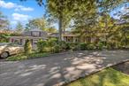 Truly One of a Kind Custom Built Expanded Sprawling Ranch with Endless Possibilities that is Flooded with Natural Light. Presently used as Large Home with a Separate 4 Room Office with Private Entrances. The Additional Oversized 3-4 BR Home with LR with Gas Fireplace - FDR and Huge EIK has Multiple Extensions. This Home Cannot Easily Be Described or Categorized with its Endless Possibilities and Floorplans and Lots of Room for Everyone! There is Plenty of Room to Consider Main Level Mother/Daughter with proper permits required. New EIK with Ample Quartz Countertops and Stainless Appliances plus Dining Room Sized Eat In Area that Overlooks Private, Professionally Landscaped Half Acre Lot. Gleaming Hardwood Floors Throughout with All Oversized Rooms and 4 New Full Baths. The Basement is Full and Finished with New Gas Burner and Indirect Hot Water Heater and Separate Laundry and Storage Areas. Upgraded Electric and Generator Hookup. Maintenance Free Exterior with 2.5 Car Heated Detached Garage, Two Sheds and Circular Driveway with Room to Park 10 Cars. The Half Acre Lot is Professionally Landscaped and Private with this over 3400 square foot home nestled perfectly to provide room for patio, yard, deck and a cozy front porch to welcome you Home!