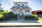 The Wait Is Over. Welcome to this 2 Bedroom Cape sitting on 3 LOTS. Can Either Purchase and Fix Up as Desired and/or Perfect for Builders to Start Over and Potentially Put up 2 Houses. 1st Fl. LR, DR, Kitchen (With Washer and Gas Dryer), 2nd Floor 2 Nice Sized Bedrooms with Lots of Closet Space and 1 Full Bathroom. Also, a Full Unfinished Basement. Back Door Sliders that Overlooks a Very Large Yard and Carport and Shed is a Gift. An Absolute Must See.