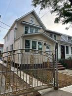 Fully renovated house- Brand new roof, brand new siding, new hardwood floor, new kitchen, granite countertop with blue cabinet, new 3 bathrooms, 4 bathrooms, new boiler, new hot water tank, new washer and dryer, finished tiles basement with full bathroom, full attic. One and a half blocks away Sutphin Blvd Bus Station,