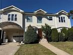 Welcome to this beautifully upgraded Colonial in Baldwin Harbor, offering spacious living, smart updates, and energy-efficient features. Renovated in 2020, this home includes 5 bedrooms, 4 full bathrooms, a huge finished basement, and solar panels for reduced energy costs.The first floor features two large living rooms, a modern kitchen with stainless steel appliances, and a full bathroom â€” perfect for entertaining or hosting guests.Upstairs, the second floor offers four spacious bedrooms and two full bathrooms, including a well-proportioned primary suite.The full finished basement adds even more living space with a fourth full bathroom â€” ideal for a home office, gym, playroom, or guest suite.This home also includes hardwood floors throughout, central air conditioning, a large open backyard with deck, a welcoming front porch, in-ground sprinklers, and owned solar panels to help lower utility bills.Set on an 8, 680 sq ft lot on a quiet residential street close to Baldwin Park, schools, shopping, and major transportation, this move-in ready home offers the perfect combination of comfort, efficiency, and convenience.