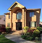 Discover this beautifully renovated and remodeled brick colonial in the desirable New Hyde Park, Long Island. Perfectly situated for a peaceful setting with all necessary amenities close by, and is just a short 15-minute drive to the vibrant hub of Flushing.House was completely rebuilt in 2008, this spacious residence features 5 large bedrooms, 3.5 full baths, and a full finished basement with a separate office. The heart of the home is the gorgeous eat-in kitchen, complete with rich cherry wood cabinetry, gas cooking, stainless steel appliances, granite countertops, and a functional central island and peninsula.The open and flowing layout is complemented by gleaming hardwood floors, LED lighting, and Pella windows. Additional upgrades include remote-controlled skylights, central air, an inground sprinkler system, a Trex deck, and a full alarm system. This property is a rare find, ideal for both living and investment.