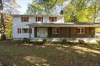 Charming Colonial Home on Private 1-Acre Lot. Welcome to your next home, nestled on a peaceful, partially wooded acre in the desirable Little Switzerland neighborhood within the Arlington Central School District. This spacious 5-bedroom, 3-bath colonial offers just under 3, 000 sq ft of living space, perfect for growing families or those who love to entertain. Step onto the inviting rocking chair front porch, ideal for relaxing mornings or evening chats. Inside, you&rsquo;ll find a traditional layout with generous room sizes throughout. The family room features a cozy wood-burning fireplace, creating a warm and welcoming atmosphere. A large screened-in porch with an extended open deck, perfect for outdoor dining and enjoying the serene, flat backyardâ€”ideal for gatherings, gardening, or play.The home includes a spacious 2-car attached garage and a full unfinished basement, offering plenty of storage or potential for future living space. While the home does need cosmetic updating, itâ€™s a solid canvas just waiting for your personal touch. If youâ€™re looking for space, privacy, and potential in a great location, this is the one. Come see the possibilities and make this house your home!