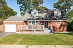 This Beautiful Large Expanded Cape In Lindenhurst School District. Featuring An Updated And Refinished First Floor Kitchen, Living And Dining Room, Primary Bedroom, Bathroom And An Additional Great Sized Bonus Room Ideal For An Office Or Den, Extended Living Room. Two Additional Large Sized Bedrooms And A Full Bath Complete The Upstairs. Outside Features Include A Deck And An Inviting Front Porch. Huge Basement Perfect Sized For Storage Plus Additional Living Space And Room For Everyone!!