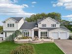 Located in the prestigious Country Woods Estates of Commack, this custom expanded five-bedroom, five-bath Colonial blends Old World sophistication with modern luxury. The stately stucco and stone fa&#231;ade, paver drive, and fountain courtyard create a commanding presence from the moment you arrive. A grand two-story foyer with wrought-iron double doors and a sweeping staircase featuring ornamental iron railings introduces interiors rich with marble, granite, and fine millwork. The gourmet kitchen, with a large center island, high-end stainless-steel appliances, and breakfast area, flows seamlessly into the family room and entertainment bar room, joined by a dual fireplaceâ€”the perfect ambiance for hosting and relaxation. Adjacent to the bar room, a professional home theater offers a true cinematic experience, continuing the homeâ€™s entertainer-focused design. The main level also includes a versatile bedroom or home office, a convenient laundry room, and access to a two-car garage. Upstairs, the thoughtful layout showcases a private primary suite wing with spa bath and custom closets, while the opposite wing includes four additional bedrooms, two with en suite baths, providing privacy and flexibility for family or guests.The lower level features a full fitness gym, designed for wellness and recreation. Outdoors, enjoy resort-style living with a heated in-ground pool, multi-tiered stone patios, dual gazebos, and a fully equipped outdoor kitchen with dining area and full bathroomâ€”all surrounded by lush landscaping and accent lighting for ultimate privacy.A rare opportunity to own one of Country Woodsâ€™ most distinctive residencesâ€”where timeless design, thoughtful architecture, and modern elegance come together in perfect harmony.