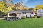Welcome to 12 Fernwood Drive, a beautifully updated 4-bedroom, 3-full-bath bi-level located in one of New Cityâ€™s most desirable neighborhoods. This spacious 2, 400 sq ft home blends comfort, style, and convenience in the award-winning Clarkstown School District, featuring Laurel Plains Elementary and Clarkstown South High School. Step inside to discover gleaming hardwood floors, a bright eat-in kitchen, and a formal dining room perfect for entertaining. The open layout flows seamlessly to an oversized deck overlooking a private backyardâ€”ideal for gatherings, relaxing, or play. The home also includes a new roof, central air conditioning, and a one-car garage. Three full bathrooms provide flexibility for modern living, whether hosting guests, working from home, or accommodating extended family. Enjoy the best of both worlds: a peaceful residential setting with the convenience of being walking distance to downtown New City, where youâ€™ll find shopping, dining, and community amenities. With easy access to major highways and public transportation, commuting to NYC or Westchester County is a breeze. Move right in and experience the perfect blend of suburban tranquility and urban accessibility that makes New City one of Rockland Countyâ€™s most sought-after places to live.