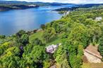 Spectacular 10+ acres of breathtaking Hudson River views and frontage with more than 500 feet of direct riverfront and panoramic sunset views. This exceptional building lot features a 2, 200 square foot cape cod style home built in 1951, a beautiful stone wall along the historic Wheeler Hill Road, mature trees for privacy, and mature landscaped grounds. Enjoy the short 2 minuter drive to the Metro-North train station for an easy commute to NYC. The property is surrounded by the best of the Hudson Valley â€” local farm stands and farmers markets, Obercreek Farm & Brewery, apple orchards, and outstanding restaurants. Beaconâ€™s vibrant Main Street is just 10 minutes away. Ideally located just 90 minutes from New York City with convenient access to Metro-North, I-84, and I-87.Existing improvements include a 2, 200 square foot home built, detached garage, and former tennis court. Driveway off Wheeler Hill Road, municipal water, and other infrastructure already in place for future building. Bring your plans, architect, builder, and vision â€” opportunities like this are exceedingly rare.