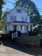 Perched on a hillside, overlooking Northport village, 32 Vail Street is a fixer-upper house that wants to be a home again. Make your This Old House and HGTV dreams come true in this 3 BR Victorian, complete with pocket doors and a walk-up granny attic! With some restoration and renovation, you could soon be hosting the holidays in your spacious dining room or watching the gorgeous sunsets from your porch swing! Low taxes (including the village) sweeten the potential.