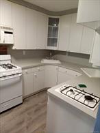 Great move-in condition condo with a private entrance! Currently set up as 3 bedrooms, but a wall can be removed to convert it back to 2 bedrooms. With 3 bedrooms, the living and dining area is smaller. Features hardwood floors throughout.