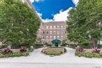 Welcome to this elegant doorman condo on vibrant 7th Street. This sunlit unit features an open-concept living and dining area overlooking a serene courtyard. Enjoy two spacious bedrooms and two full baths, including an en-suite in the primary bedroom. Building amenities include a fitness center, community room, laundry, storage, and 1-car garage parking. Just steps from boutique shopping, cafes, restaurants, and minutes to the LIRR, banks, and the library â€” everything you need is right here. Make this exceptional residence your new home in the heart of Garden City.