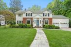 Welcome to this sun-drenched 4-bedroom, 4.5-bath Colonial, ideally situated on a quiet mid-block street in the well landscaped Village of Russell Gardens.This classic home offers wonderful living space, including a large den and a separate office on the main floor. The spacious eat-in kitchen opens to a generous deck, perfect for entertaining or simply unwinding at the end of the day.Upstairs, the primary bedroom features an ensuite bath and an adjoining area that can serve as a home office, sitting room, or any other flexible use to suit your needs.Residents enjoy access to the communityâ€™s private pool and tennis facilities. Conveniently located near major highways and just a short distance to the train, shops, and transportation, this home offers both comfort and convenience in a prime location.