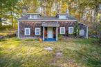 Own a piece of history! This home pre-dates the Revolution and sits on its original site just waiting for someone to restore to its original glory! In its early days,  it was believed to have been a tenant house for a large farm to the West. Property was later dubbed The Schoolteachersâ€™ house when it was purchased by 2 schoolteachers as a summer home in 1926. This 2 bedroom home features post and beam construction, wide plank flooring, formal Dining room and sunken living room with stone fireplace and wood burning stove. Home is situated on 1.02 acres with several outbuildings and a detached, 3 car garage.   A true passion project! Cash or rehab